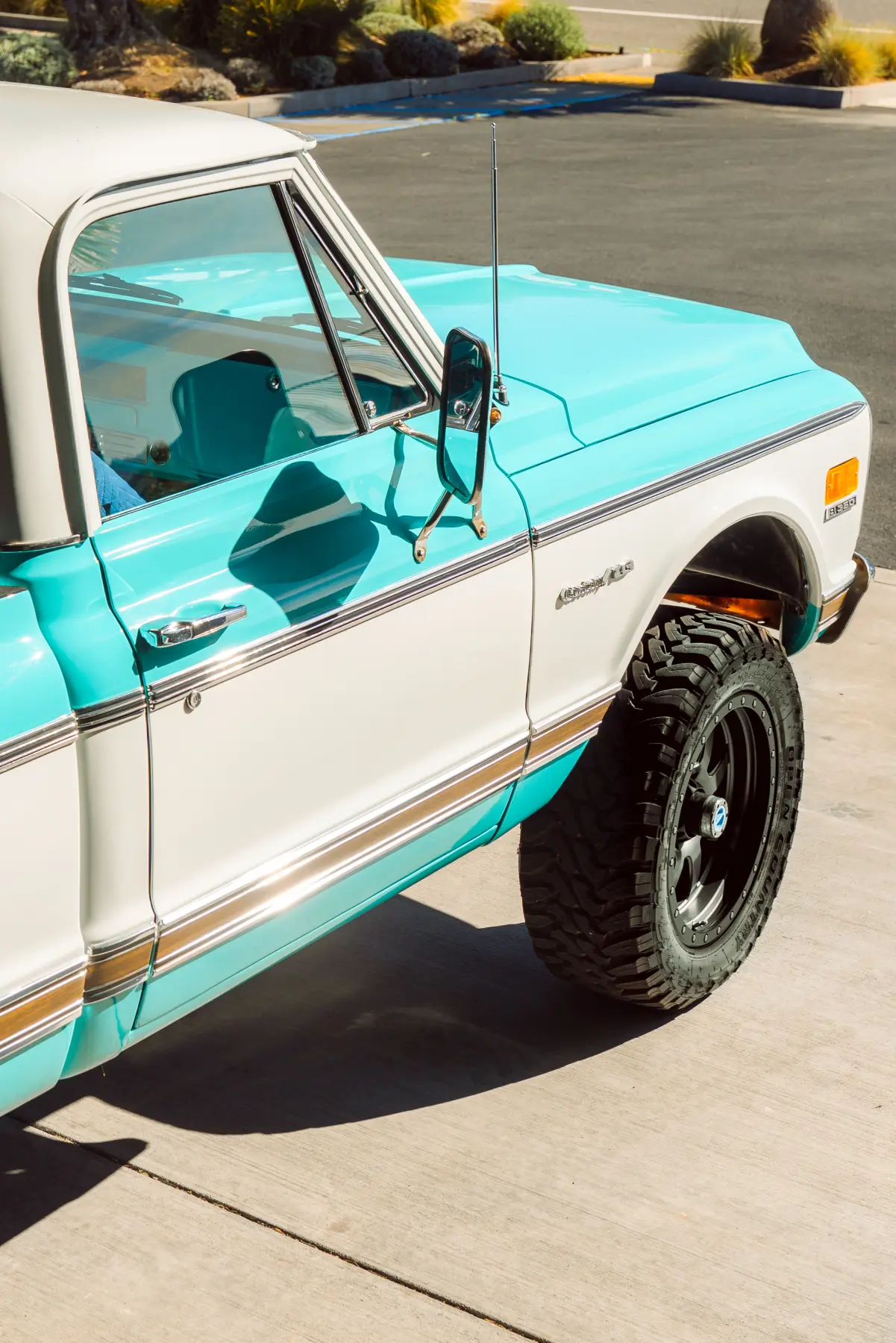 Two-tone teal and white Chevrolet C10 pickup restored at Kreations Auto Body